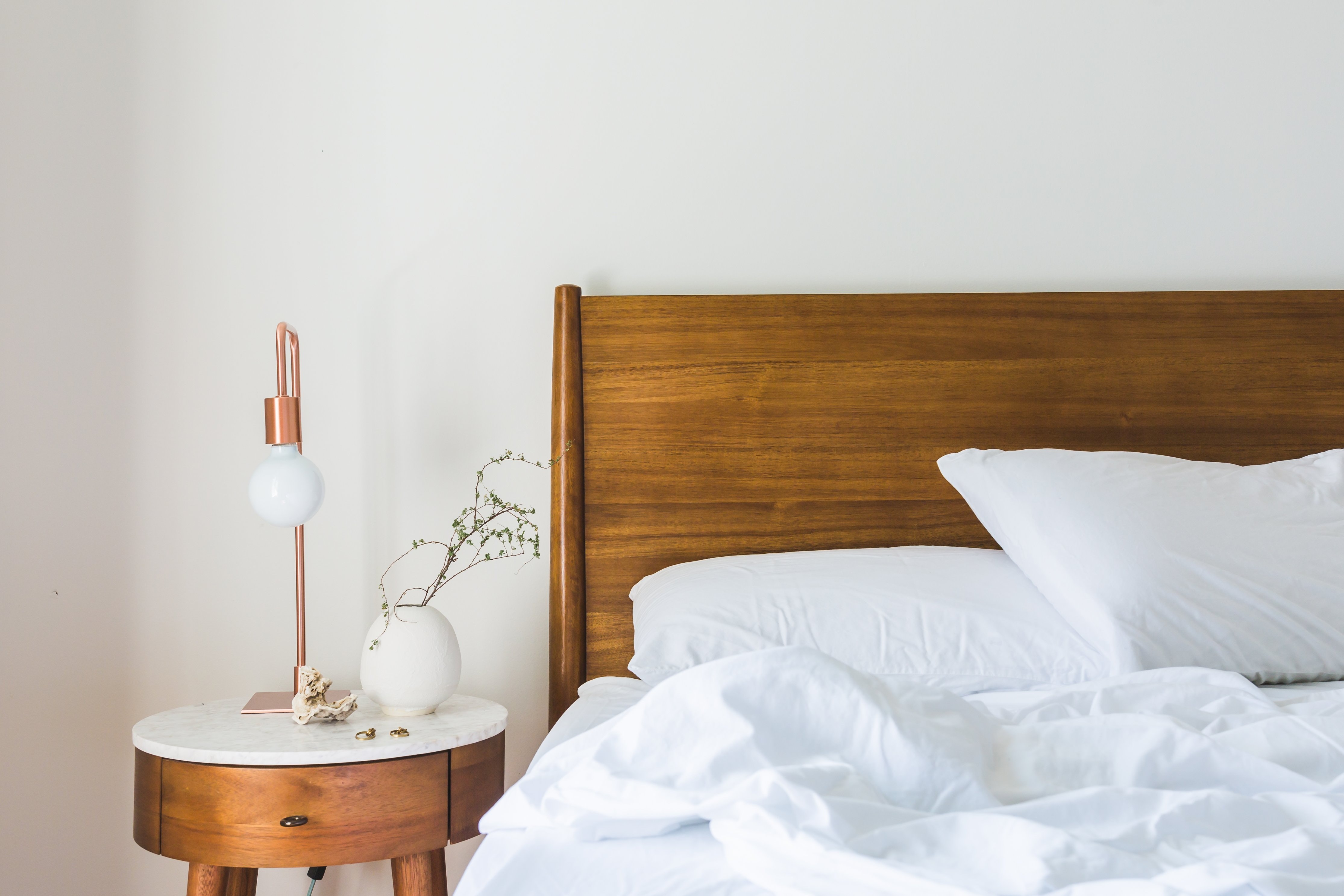 Bed with bedside table